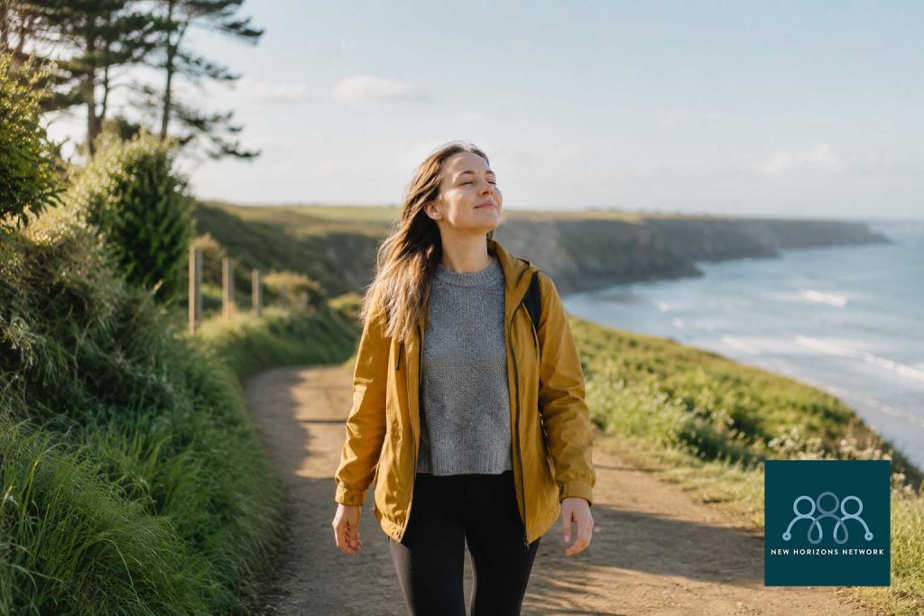 Person walking outdoors in nature representing healthy ways to break the alcohol and anxiety cycle